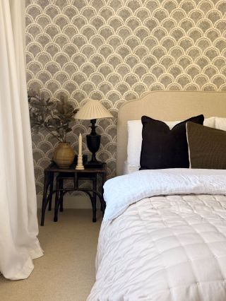 cream bedroom carpet with a double bed